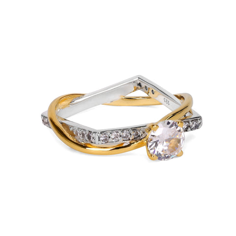 Gold and silver ring with a diamond on a white background